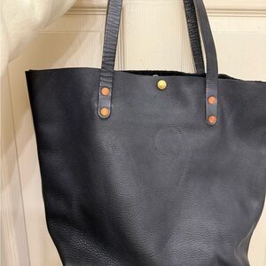 Sleek Black Leather Tote with Brass Accents